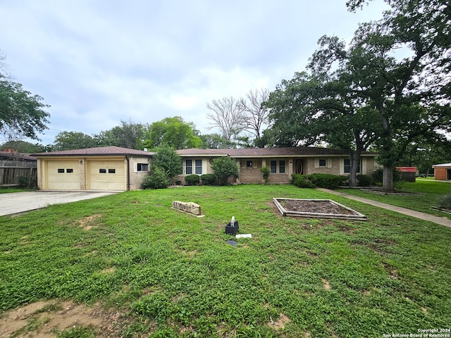 ranch-style home with a garage and a front yard