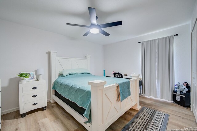 bedroom with ceiling fan and light wood-type flooring