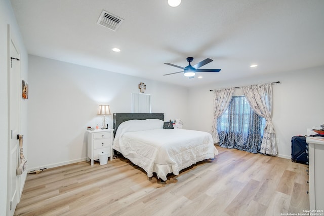 bedroom featuring ceiling fan and light hardwood / wood-style floors