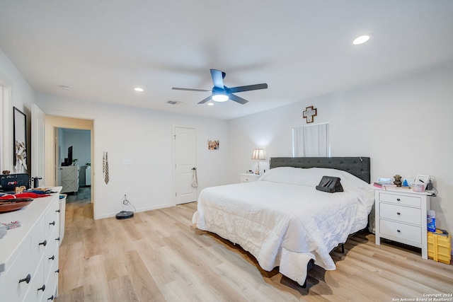 bedroom with ceiling fan and light hardwood / wood-style floors