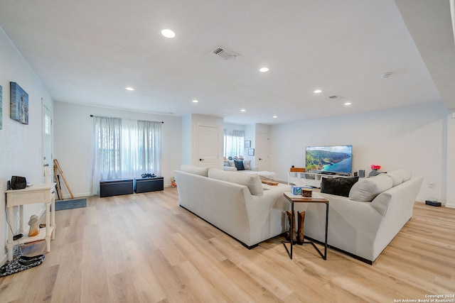 living room with light hardwood / wood-style flooring