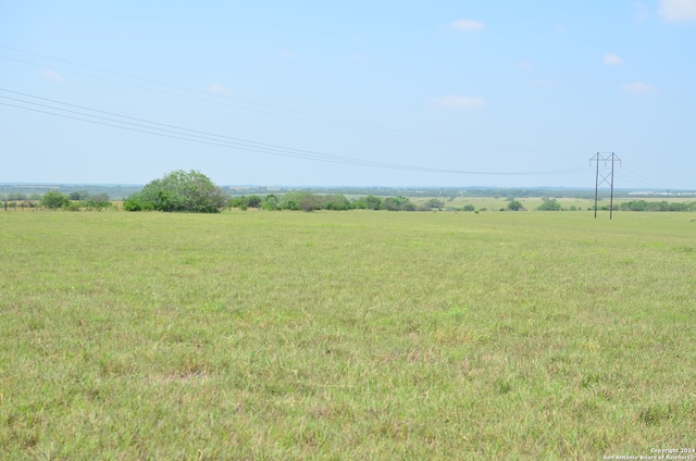 view of yard with a rural view