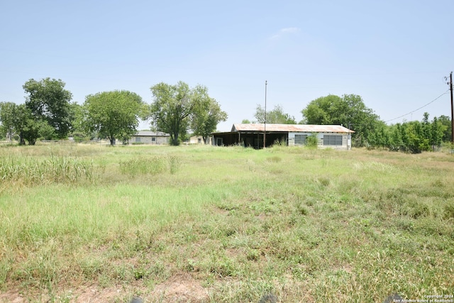 view of yard with a rural view