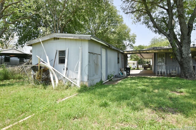 rear view of house featuring a yard