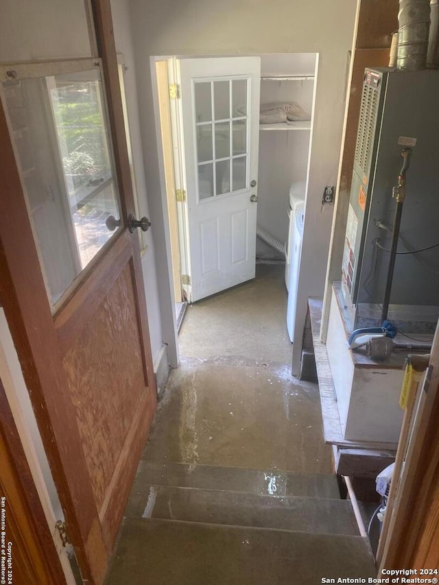 interior space with washing machine and dryer and concrete floors