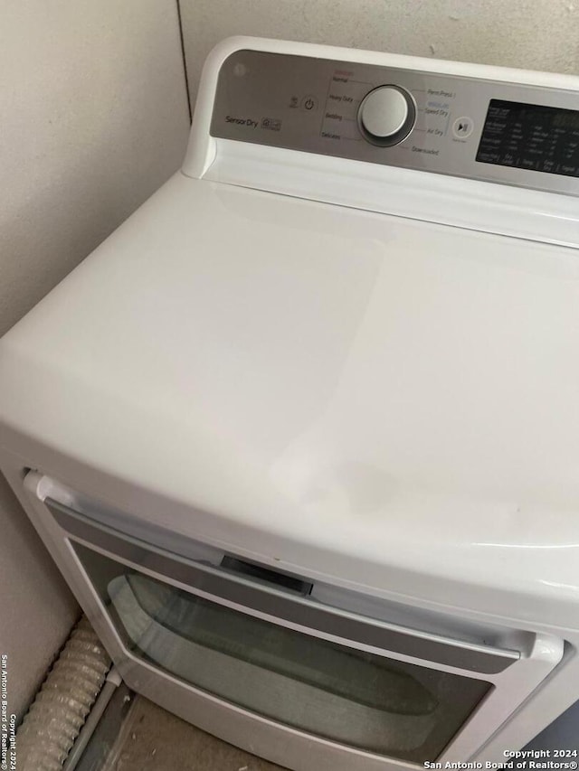 interior details featuring washer / clothes dryer and a mail area