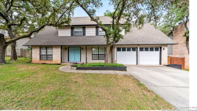 front facade with a garage and a front yard