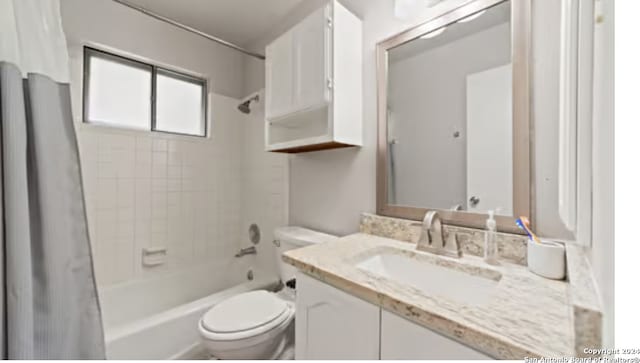 full bathroom with shower / tub combo with curtain, toilet, and vanity