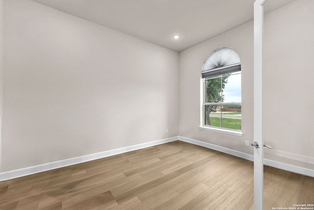 spare room featuring light wood-type flooring