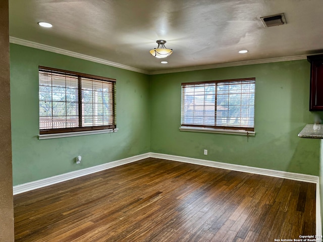 unfurnished room with dark hardwood / wood-style floors and ornamental molding