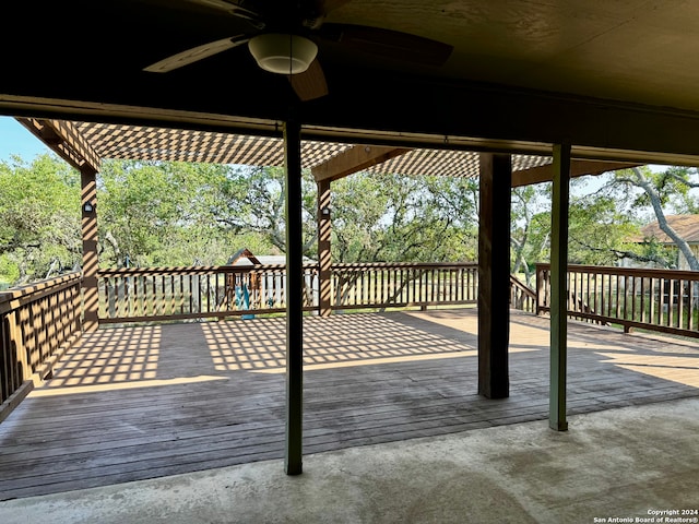 wooden terrace featuring ceiling fan