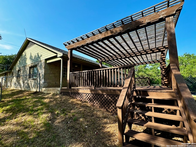 exterior space with a pergola and a wooden deck