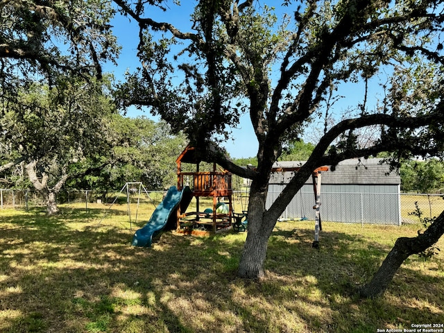 view of jungle gym with a lawn