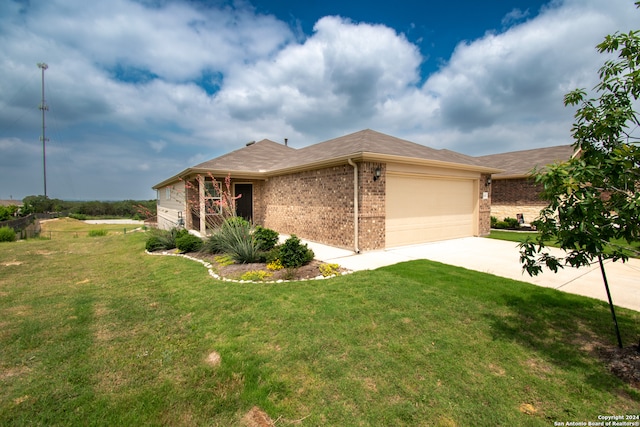 view of front of house with a garage and a front yard