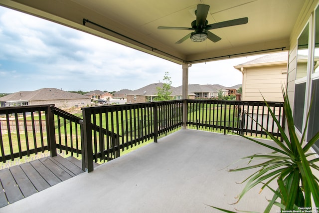 exterior space with ceiling fan