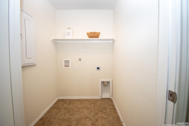 washroom with tile floors, hookup for an electric dryer, washer hookup, and hookup for a gas dryer