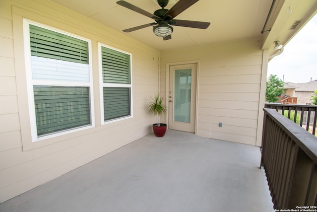 exterior space featuring ceiling fan