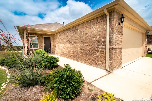 ranch-style house featuring a garage