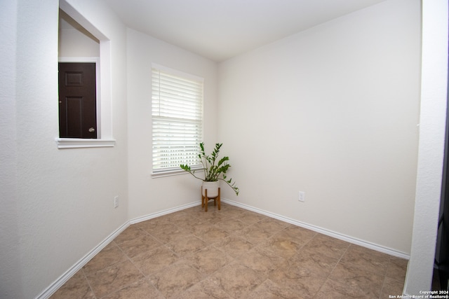 empty room featuring tile flooring