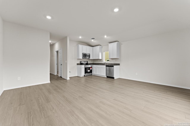 unfurnished living room with light hardwood / wood-style flooring