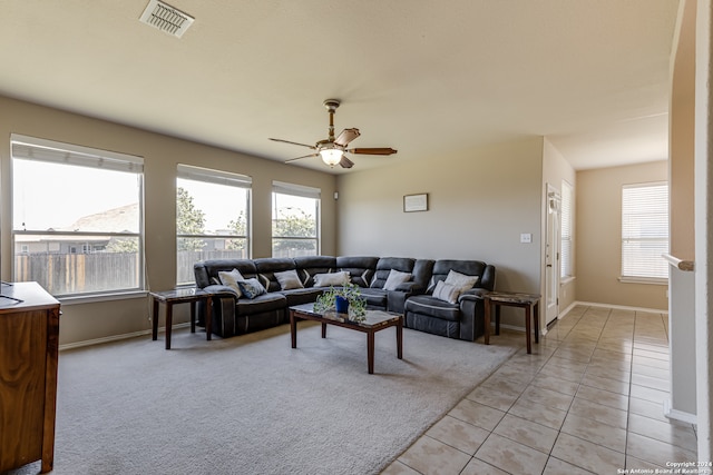 living room with ceiling fan and light tile flooring