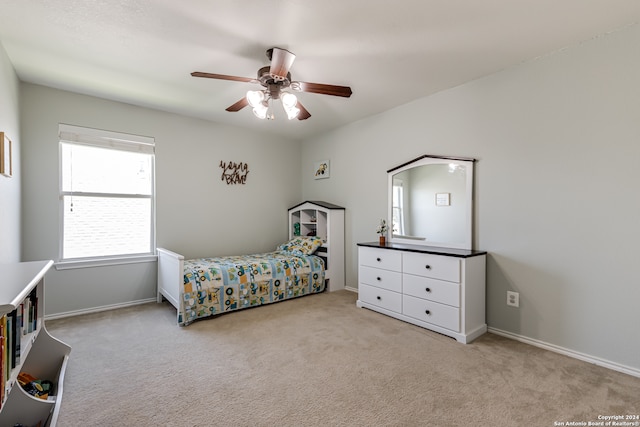 carpeted bedroom with ceiling fan