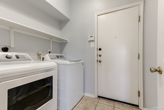 washroom featuring independent washer and dryer, hookup for an electric dryer, and light tile floors