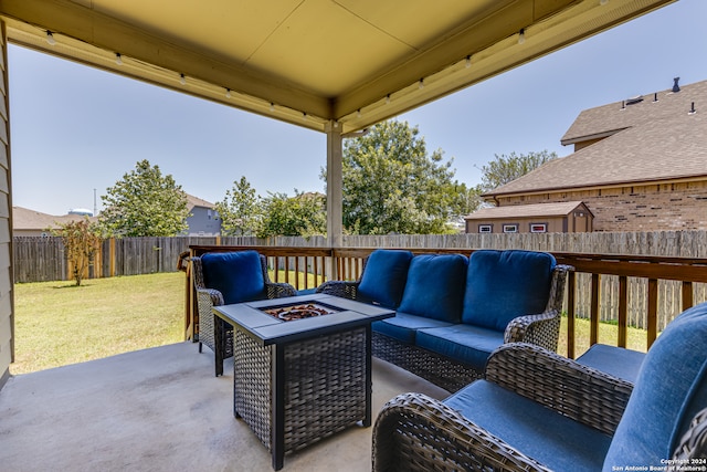 view of patio featuring an outdoor living space with a fire pit