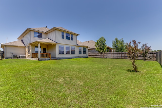 rear view of house with a lawn