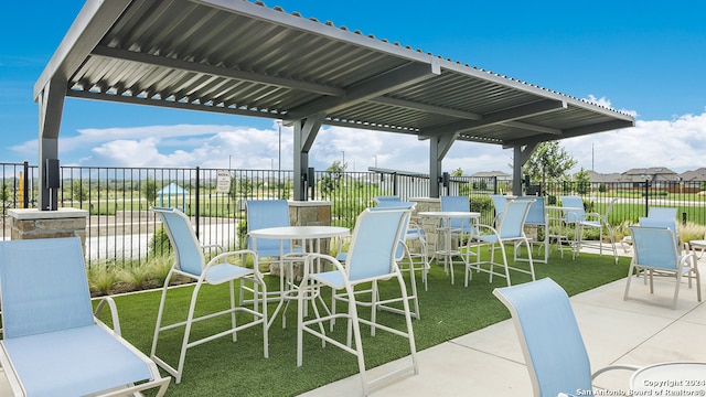 view of patio featuring fence