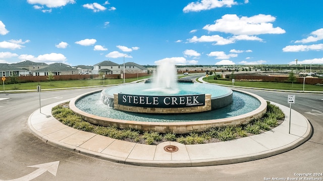 surrounding community featuring a residential view and a yard