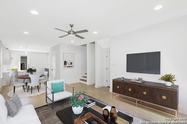 living room featuring ceiling fan