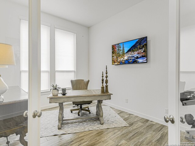 office area with wood-type flooring