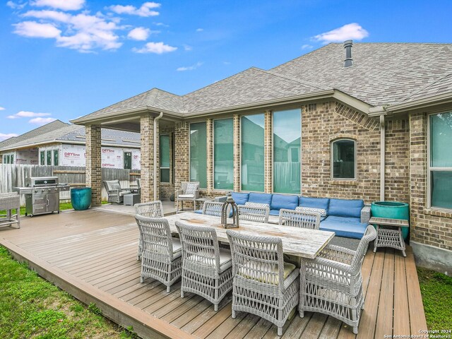 deck with an outdoor hangout area and grilling area