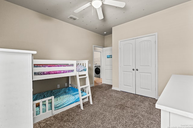 carpeted bedroom featuring a closet, washer / clothes dryer, and ceiling fan