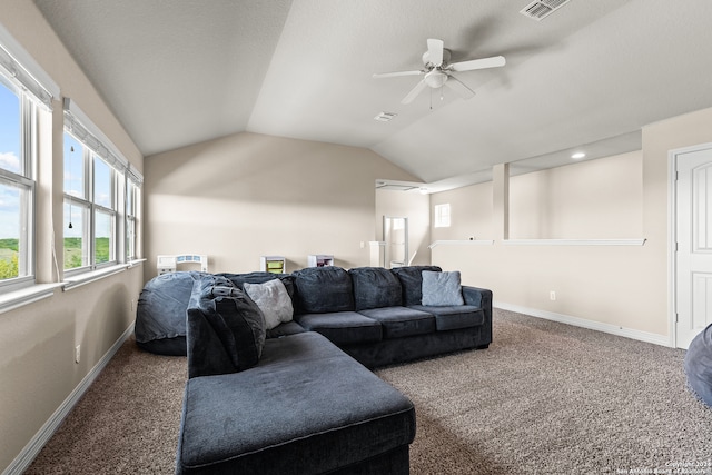 carpeted living room featuring ceiling fan and vaulted ceiling