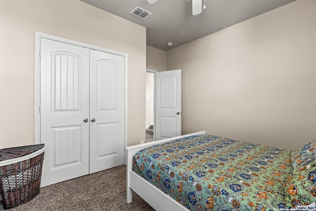 bedroom with a closet, carpet floors, and ceiling fan