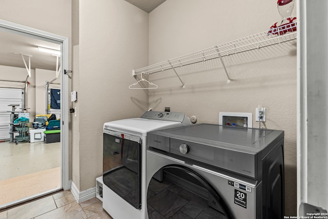 laundry room featuring washing machine and clothes dryer