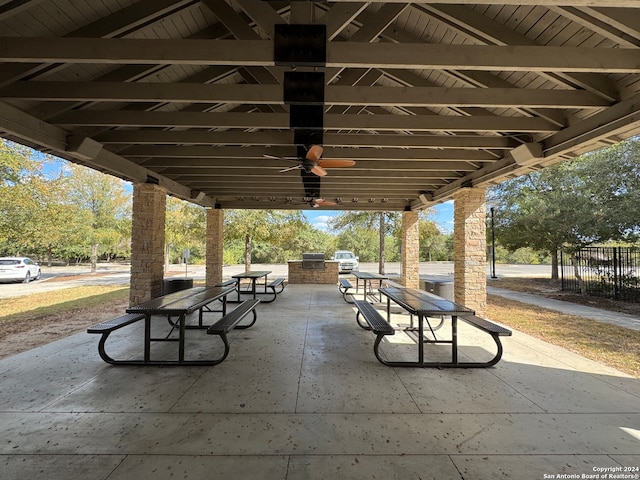 view of home's community with exterior kitchen and a patio area