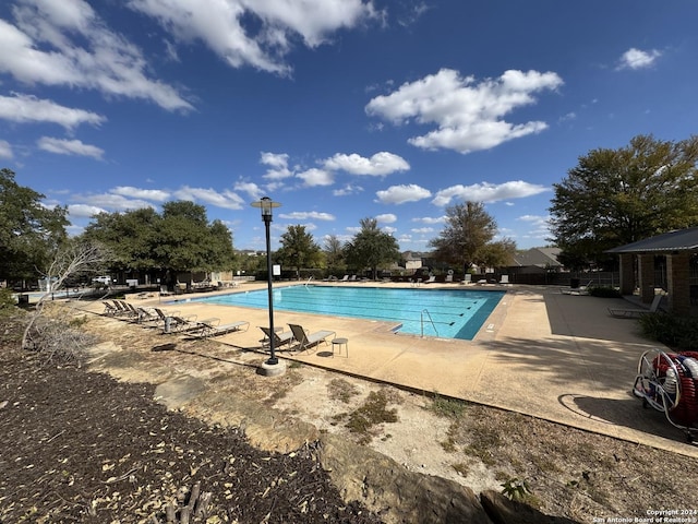 community pool with a patio