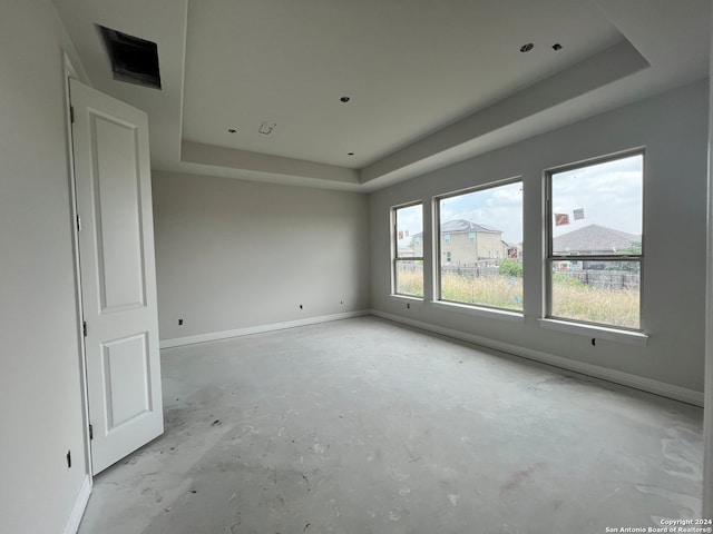 empty room with a tray ceiling