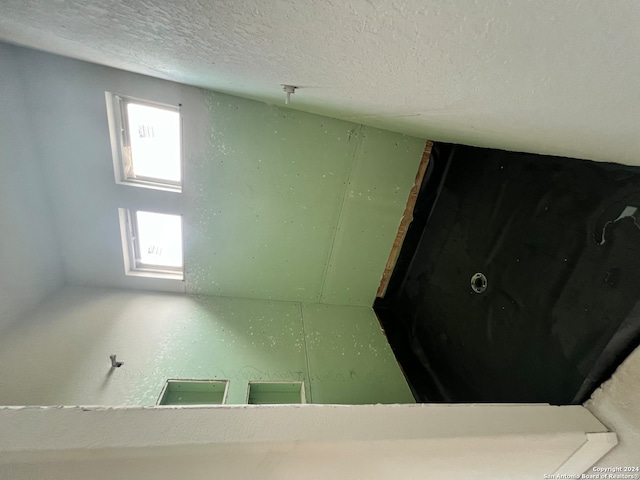 spare room featuring a textured ceiling