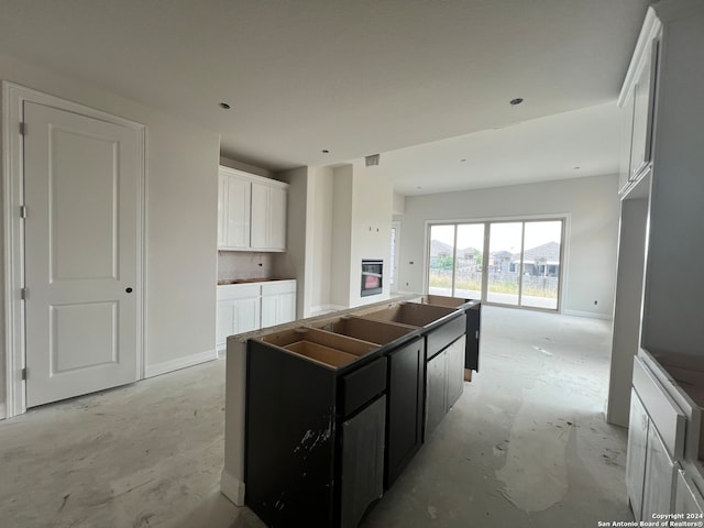 kitchen featuring white cabinets and a kitchen island