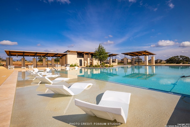 view of pool with a patio and a gazebo