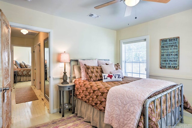 bedroom with ceiling fan and light hardwood / wood-style flooring