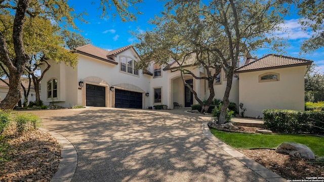 mediterranean / spanish-style house featuring a garage