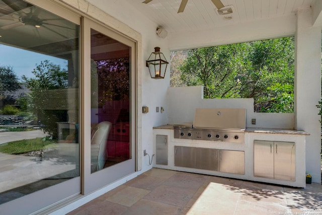 view of patio with exterior kitchen, grilling area, and ceiling fan