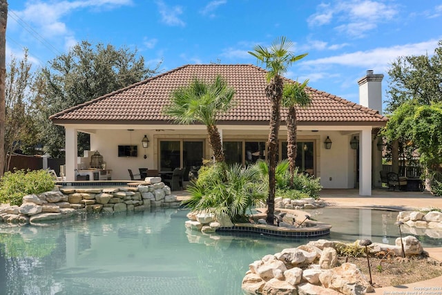 rear view of property featuring a patio