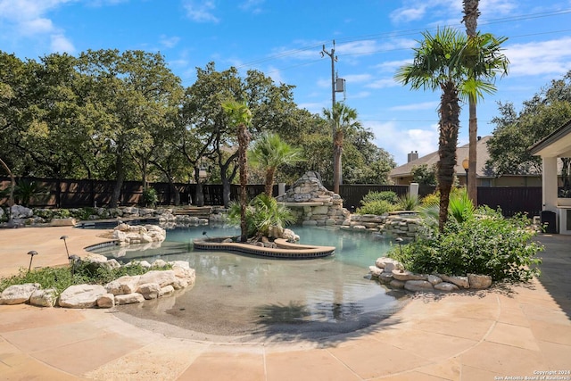 view of pool featuring a patio area