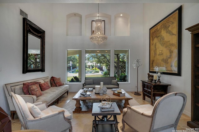 living room with a chandelier and a high ceiling